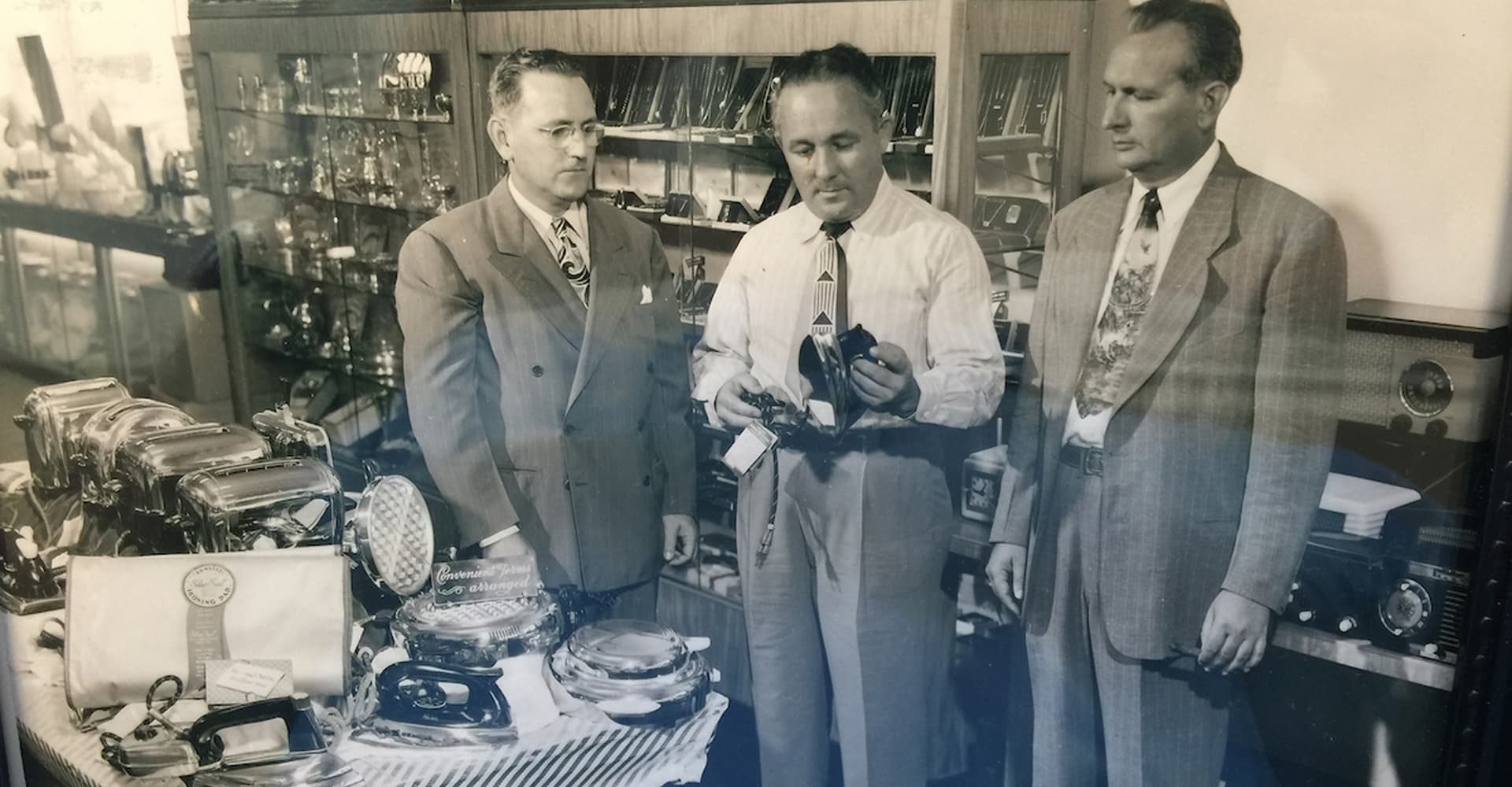 Artisan hands crafting a diamond ring with traditional tools
